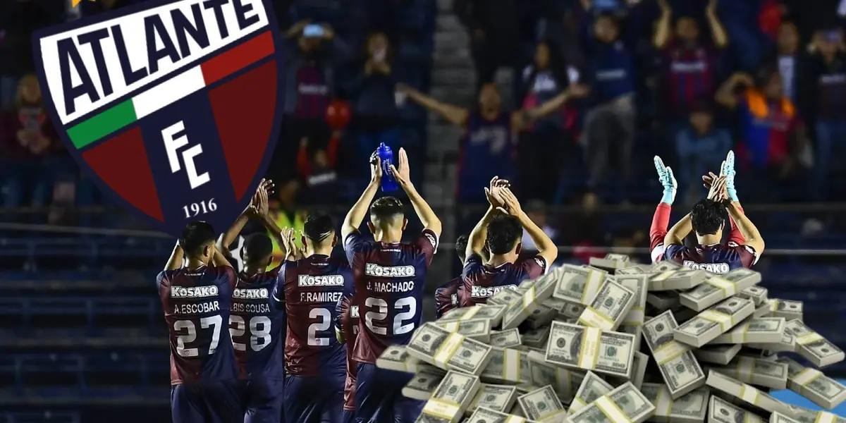 Jugadores de Atlante festejan, a la derecha montaña de dinero / Marca 